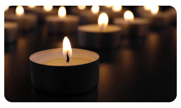 Various candles burning in memory of loved ones
